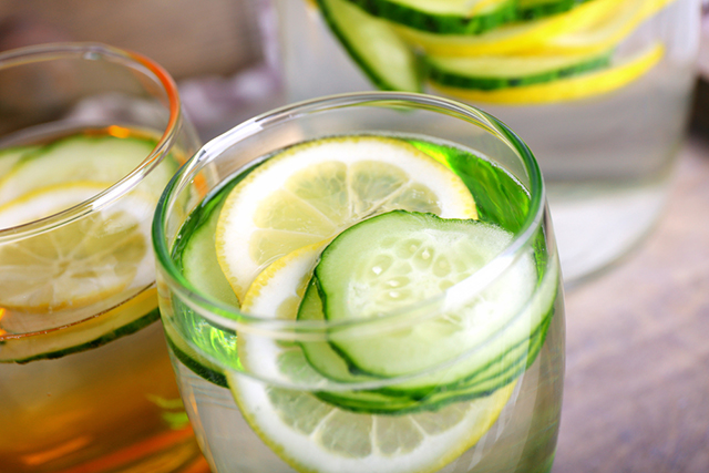 Infuse your water with cucumber, mint, or cinnamon to encourage yourself to drink more.