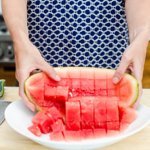 Dumping out cubed watermelon