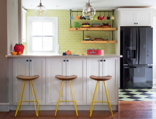 Farmhouse kitchen with yellow metal bar stools